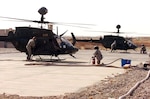 Tennessee Army National Guard Soldiers refuel two OH-58D Kiowa Warrior helicopters in northwest Iraq, Nov. 11, 2009. The Soldiers are with the Tennessee ARNG's 1-230th Air Cavalry Squadron, who maintain and operate a Forward Arming and Refueling Point, 24 hours a day, seven days a week.