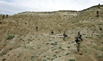 U.S. Army Soldiers from Bravo Company, 1st Battalion, 133rd Infantry Regiment, and Afghan National Army soldiers and Afghan National Civil Order Police, patrol the area outside of the Bad Pech District center in the Galuch Valley area May 4, 2011 in Laghman Province, Afghanistan.