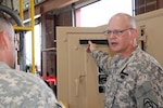 Col. William C. Hoppe, project manager for Warfighter Information Network-Tactical, discusses the work done for his organization by the West Virginia Army National Guard at its maintenance facility in Eleanor, W.V. June 7, 2011.