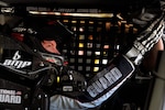 Dale Earnhardt Jr., driver of the No. 88 National Guard NASCAR racecar, does pre-race checks before the official start of the race at New Hampshire Motor Speedway in Loudon, N.H. July 17, 2011. Earnhardt now sits in ninth place in the NASCAR Sprint Cup Series points chase, two slots away from dropping out of the chase.