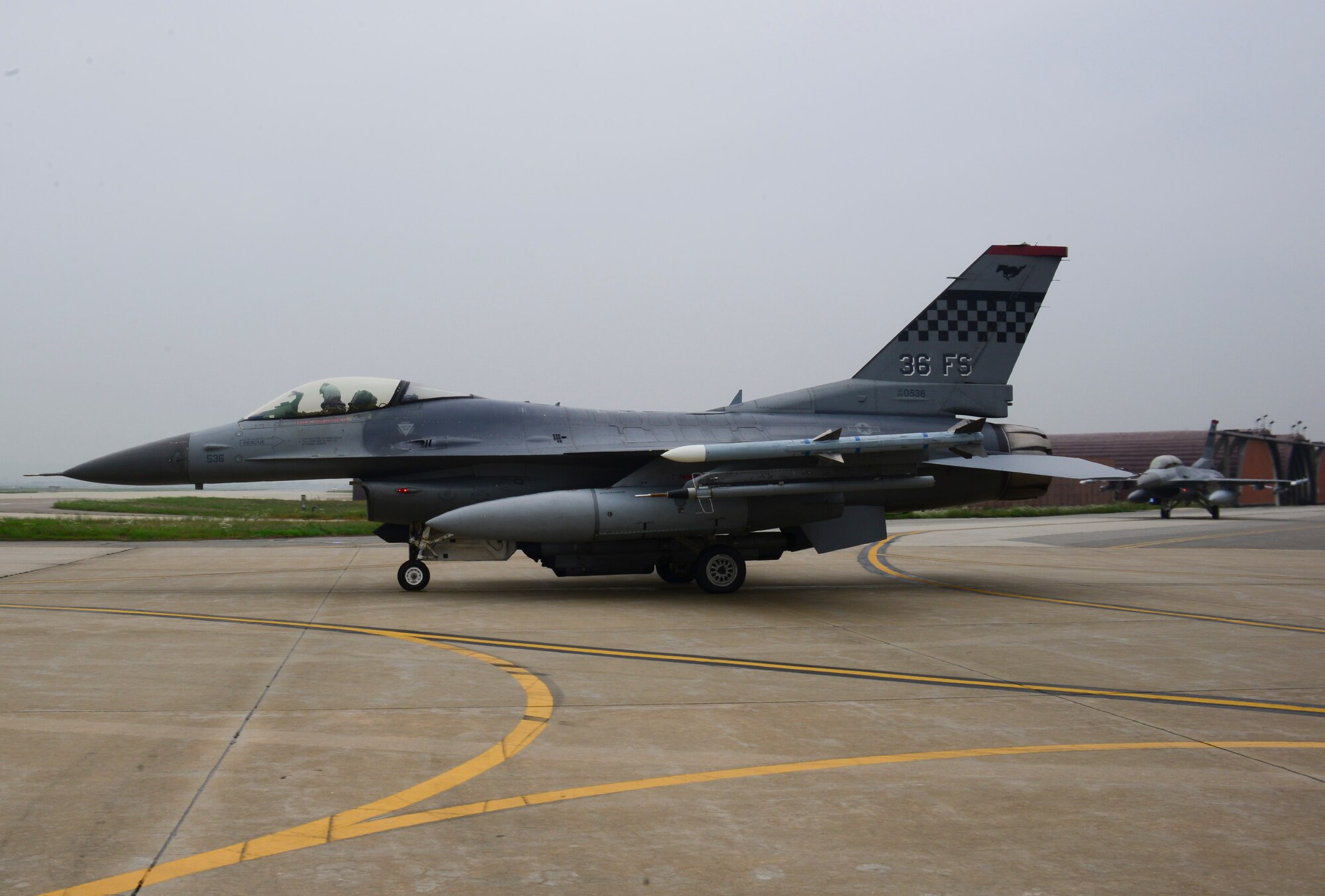 A U.S. Air Force 36th Fighter Squadron F-16C “Fighting Falcon”, prepares to launch on Osan Air Base, South Korea, July 22, 2015. In the past year, the squadron has flown more than 4,500 sorties, giving the 36th the largest F-16 flying program in the Combat Air Force. The 36th FS has a 90-year history in the Air Force, where they flew 21 different types of aircraft, received 22 unit citations and accumulated 24 service and campaign streamers since World War I. (U.S. Air Force photo by Senior Airman Kristin High/Released)