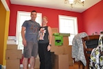 New York Army Natonal Guard Majs. Brian Bonanno  and Amy Bonanno   at their home in Clifton Park, New York, July 20, 2015, as they pack for a move to South Africa. The two veterans, both staff officers in the New York Army National Guard’s 42nd Infantry Division, are heading with their two children to Pretoria, South Africa, where Brian will be the liaison officer for the New York Army National Guard and South Africa State Partnership Program. 