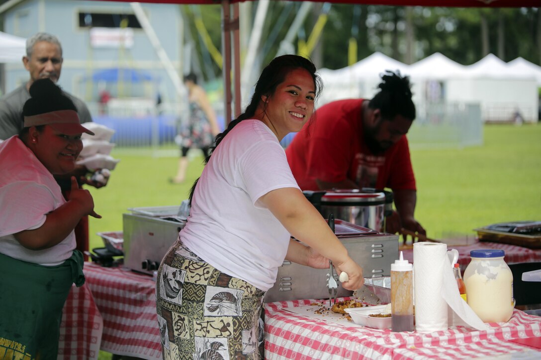 A Polynesian woman prepares a traditional dish for the local community during the North Carolina Polynesian Festival at Onslow Pines Park, North Carolina, July 24-25, 2015.  Marines, sailors and their family members volunteered and attended the annual Polynesian Festival, hosted by Onslow County, which included an introduction to the many islands that make up the Polynesian area and showcased the culture and heritage of each.  (U.S. Marine Corps photo by Cpl. Alexander Mitchell/Released)