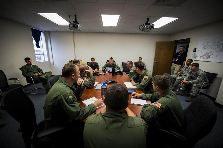 An AC-130J Ghostrider crew with the 18th Flight Test Squadron and 1st Special Operations Group Detachment 2 conduct a pre-flight briefing on Eglin Air Force Base, Fla., July 29, 2015. The 1st Special Operations Wing accepted delivery of Air Force Special Operations Command’s first AC-130J, to be flown by the 1st SOG Det. 2 and maintained by the 1st Special Operations Aircraft Maintenance Squadron. (U.S. Air Force photo/Senior Airman Christopher Callaway)