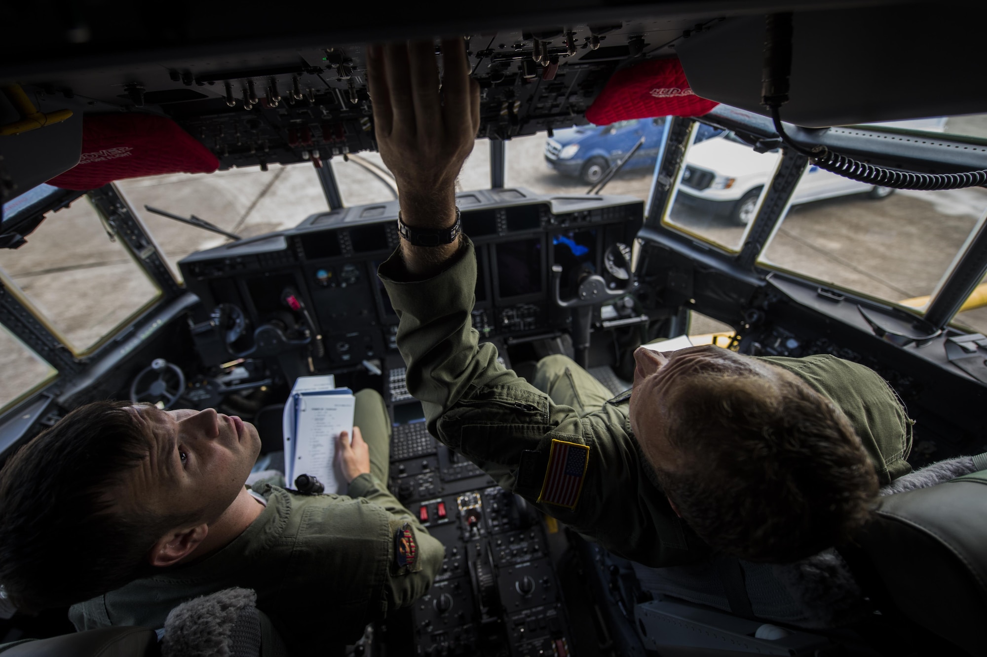 Master Sgt. James Knight right, 18th Flight Test Squadron aerial gunner, instructs Staff Sgt. Rob Turner left, 1st Special Operations Group Detachment 2 aerial gunner, on new changes regarding pre-flight inspections in an AC-130J Ghostrider on Eglin Air Force Base, Fla., July 29, 2015. The aircrews of the 1st SOG Det. 2 were hand selected from the AC-130 community for their operational expertise and will begin initial operational testing and evaluation of the AC-130J later this year. (U.S. Air Force photo/Senior Airman Christopher Callaway)