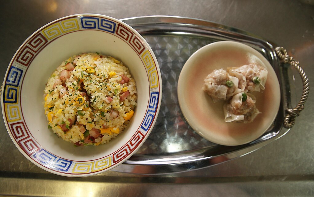 Marine Corps Air Station Iwakuni residents plate their finished Shumai and traditional fried rice during a Japanese cooking class at Fukushi Kaikan in Iwakuni, Japan, July 24, 2015. Shumai is traditionally served in small steamer baskets or on small plates and is one of three Oriental dishes prepared during the class. The station’s cultural adaptation program coordinates the class three times a year, and it is one of many ways to indulge in local cuisine.