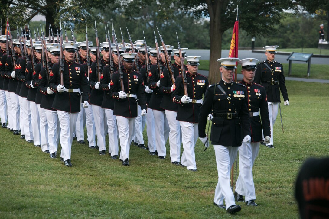 Marines from Alpha Company march during a Tuesday Sunset Parade at the Marnie Corps War Memorial, Arlington, Va., July 28, 2015. The guest of honor for the Sunset Parade was Admiral Harry Harris Jr., commander, US Pacific Command, and the hosting official was Gen. John Paxton Jr., assistant commandant of the Marine Corps. (U.S. Marine Corps photo by Cpl. Christian Varney/Released)