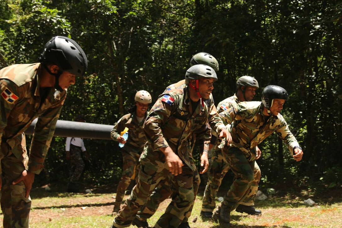 Dominican Republic special operations team members run during the Fuerzas Comando 2015 obstacle course event in Poptun, Guatemala, July 19, 2015.