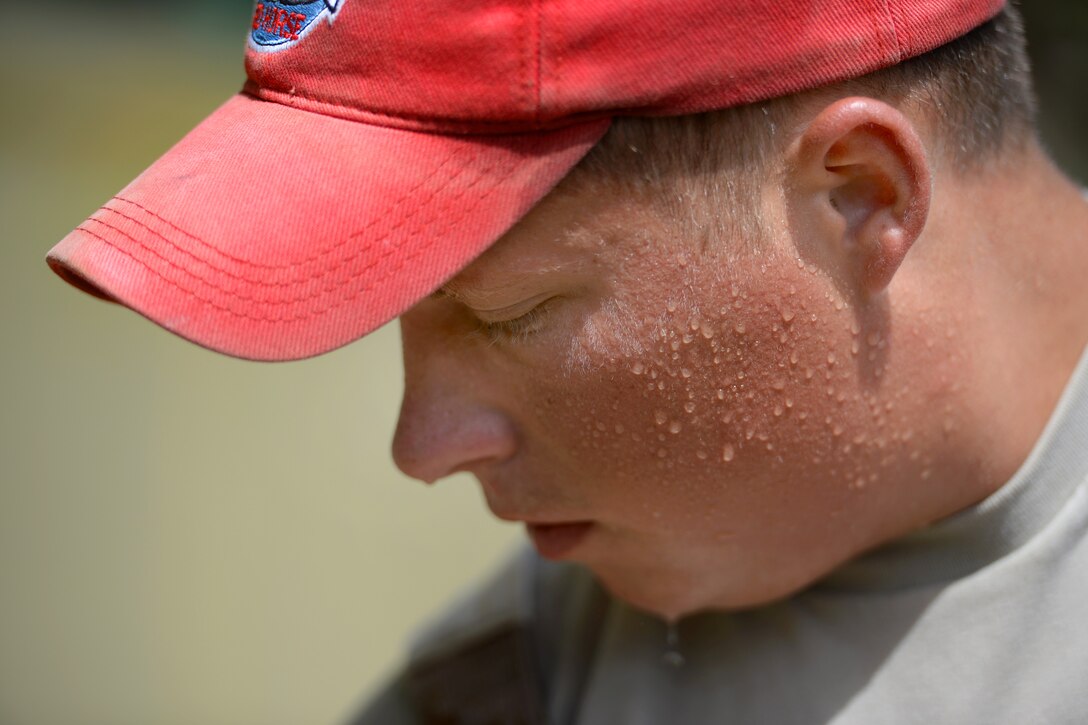 U.S. Air Force Staff Sgt. Michael Zemke paints a school during New Horizons Honduras 2015 in Ocotes Alto, Honduras, July 15, 2015. Zemke is a pavements and heavy equipment operator assigned to the 823rd Expeditionary Red Horse Squadron from Hurlburt Field, Fla.