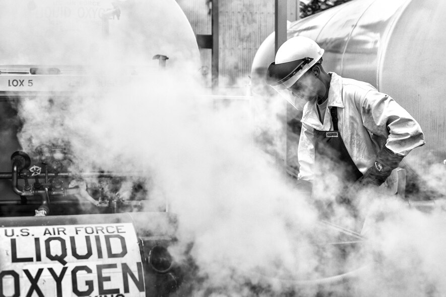 Senior Airman William Oppenheim, 374th Logistics Readiness Squadron fuels mobility support technician, issues liquid oxygen to a LOX cart July 29, 2015, at Yokota Air Base, Japan. To handle liquid oxygen, Airmen must wear proper personal-protection equipment, including glasses, face shields and long sleeve shirts. (U.S. Air Force photo by Airman 1st Class Delano Scott/Released)