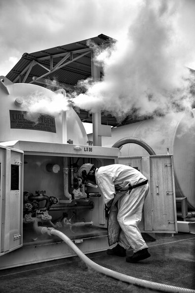 Senior Airman Christopher Benavente, 374th Logistics Readiness Squadron cryogenic technician, observes a liquid oxygen tank as it is being filled July 29, 2015, at Yokota Air Base, Japan. Airmen must remain vigilant and check for material that could cause a dangerous chemical reaction. (U.S. Air Force photo by Airman 1st Class Delano Scott/Released)