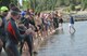 Athletes listen to directions before the swimming portion of a triathlon at Clear Lake, Wash., July 25, 2015. More than 30 athletes participated in a 500 meter swim, 15.7 mile bike ride and a 3.2 mile run. (U.S. Air Force photo/Staff Sgt. Samantha Krolikowski)