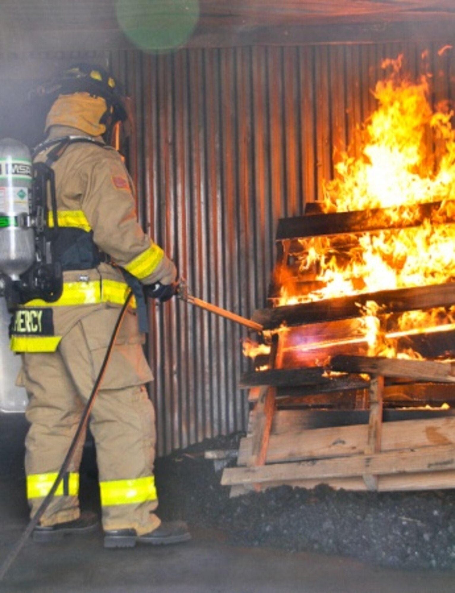 Sgt. 1st Class Jason Piercy, military fire chief with 3rd Battalion, 364th Engineer Regiment, 5th Armored Brigade, ignites a fire to begin Day 4 of a mission readiness exercise for the 907th, 702nd, 582nd and 306th Firefighting detachments at Holloman Air Force Base, N.M. (U.S. Army photo by Capt. Jennie Armstrong, 5th Armored Brigade, Division West) 