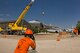 Tech. Sgt. William Nelson, 362nd Training Squadron observes students from the 362nd Training Squadron simulating removing an F-15 Eagle from a runway using a wire rope sling and a 55 ton crane in the Crash Damaged Disabled Aircraft Recovery unit at Sheppard Air Force Base, Texas July 29, 2015. The aircraft had previously experienced landing gear failure and is now used as a trainer for students the CDDAR course.  (U.S. Air Force photo by Danny Webb/Released)
