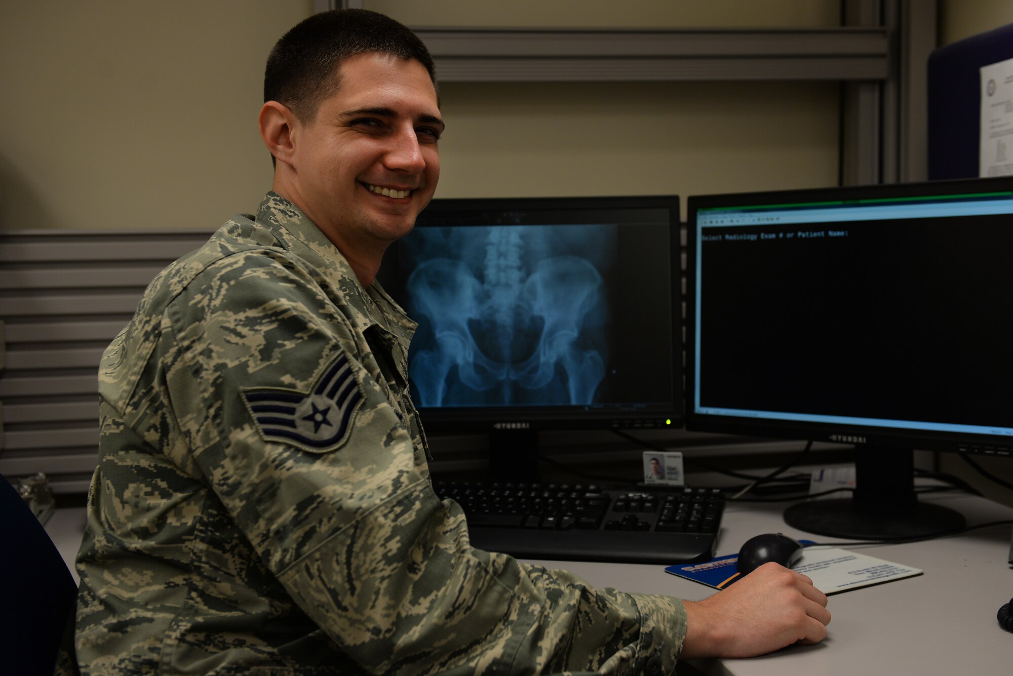 Staff Sgt. Justin Keune, 375th Medical Support Squadron Picture Archive Communication System Administrator, works with records networks to ensure patients recieve rapid radiologic care, Scott Air Force Base, July 20, 2015. Keune processes an average of 45 patient records a day. (U.S. Air Force photo by Airman 1st Class Erica Holbert-Siebert)
