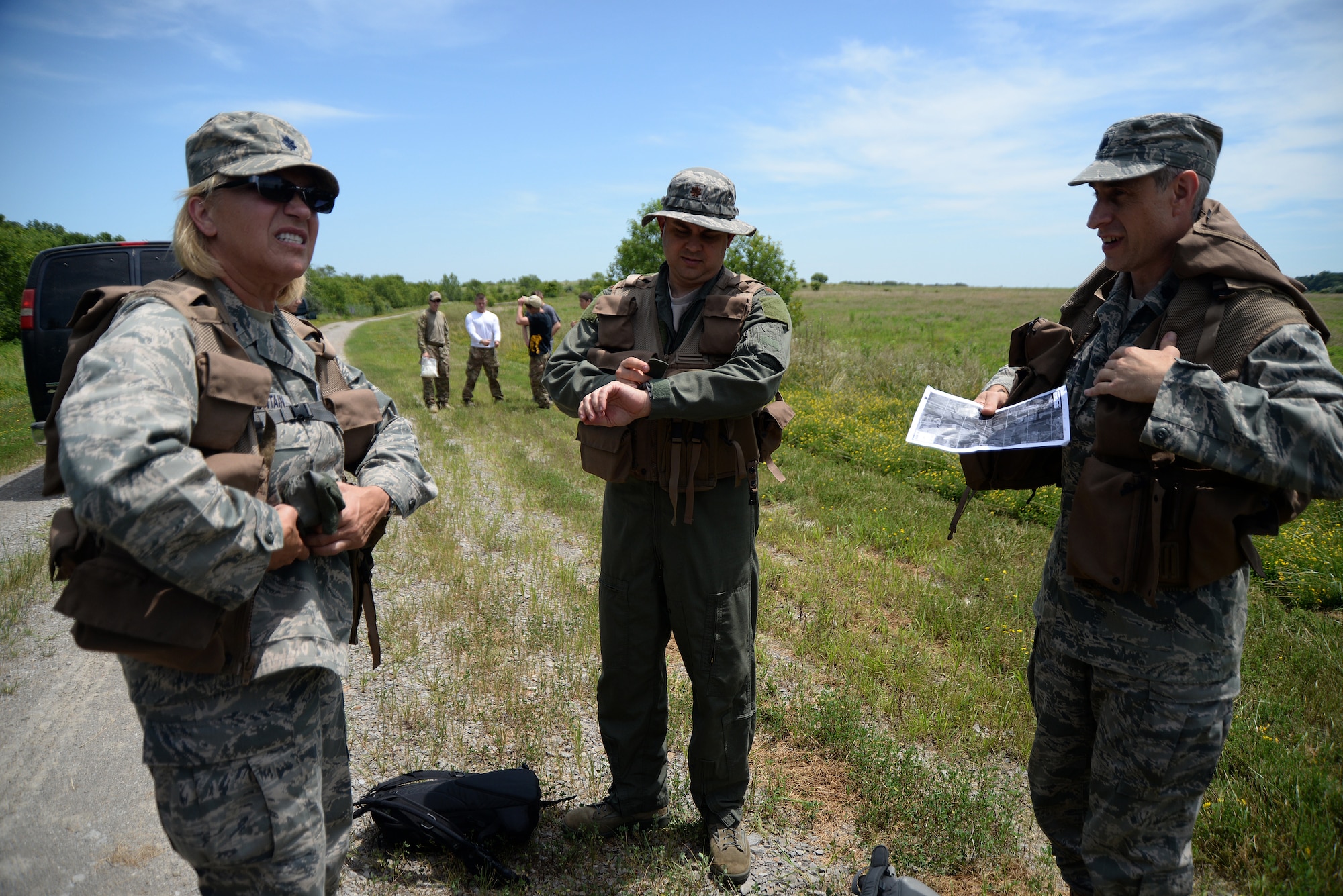 Participants of the combat survival training portion of the Survival, Evasion, Resistance, and Escape, or SERE, training prepare for a field exercise July 14, 2015, at Sparta, Ill. Scott Air Force Base has a team of specialists that teach pilots and aircrew SERE techniques each month. The training is split up into two portions: combat survival training and water survival training. (U.S. Air Force photo/Senior Airman Jake Eckhardt)