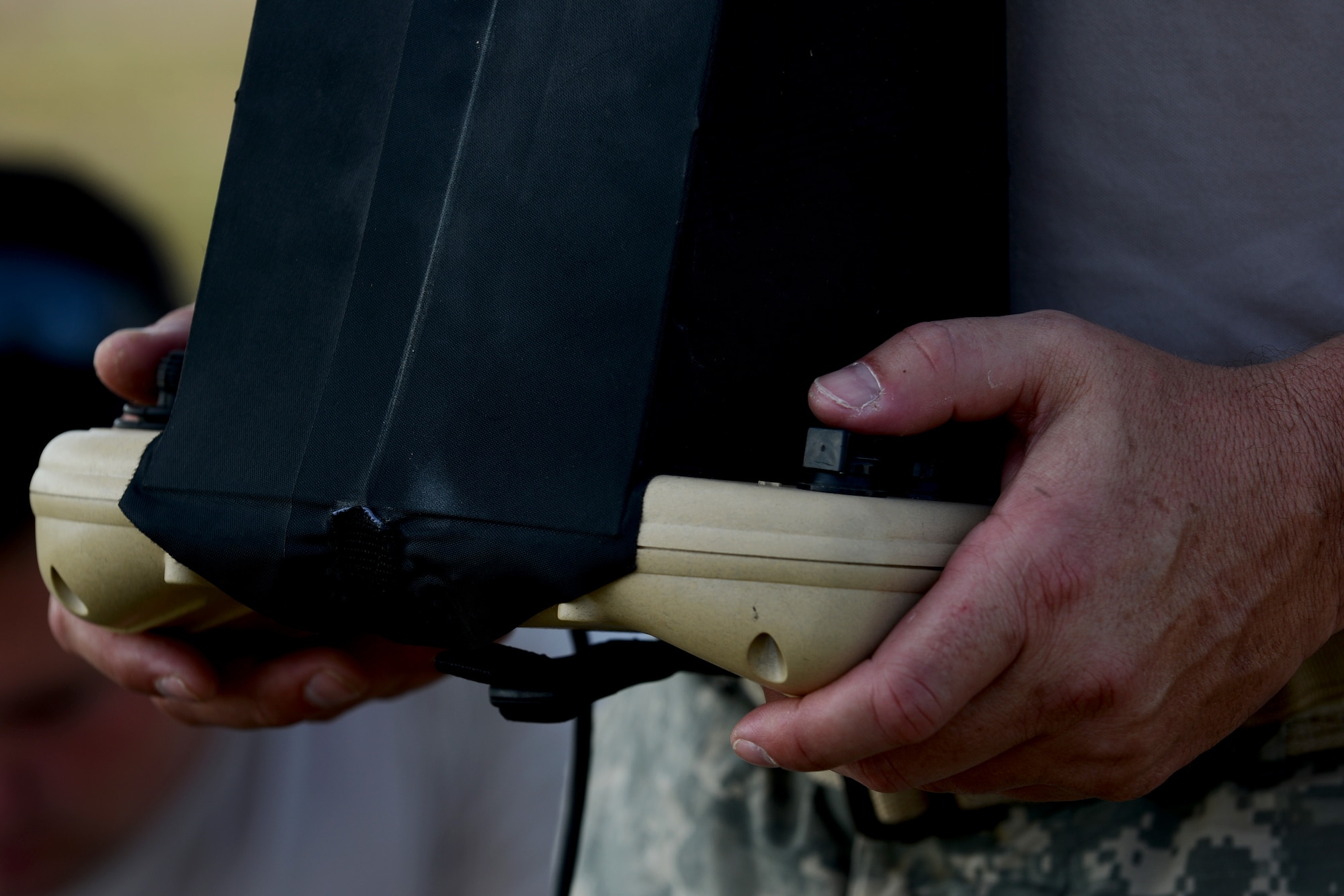 A U.S. Army National Guard soldier assigned to the South Carolina Army National Guard Marksmanship Training Unit uses a remote to fly a RQ-11B Raven during training on Small Unmanned Aerial Systems at Poinsett Electronic Combat Range, Wedgefield, S.C., July 28, 2015. The Raven weighs less than five pounds and has a battery life of up to 80 minutes. (U.S. Air Force photo by Senior Airman Diana M. Cossaboom/Released)
