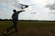 U.S. Army National Guard Sgt. 1st Class Rene Wilson, South Carolina Army National Guard Marksmanship Training Unit soldier, launches a RQ-11B Raven into flight during training on Small Unmanned Aerial Systems at Poinsett Electronic Combat Range, Wedgefield, S.C., July 28, 2015. In 2013, the range provided training for 754 aircraft from three Department of Defense services and three National Guard stations. (U.S. Air Force photo by Senior Airman Diana M. Cossaboom/Released)