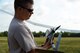 U.S. Army National Guard Sgt. 1st Class Eric Lawrence, South Carolina Army National Guard Marksmanship Training Unit assistant state marksmanship coordinator, prepares a RQ-11B Raven, a Small Unmanned Aerial System, for flight during training at Poinsett Electronic Combat Range, Wedgefield, S.C., July 28, 2015. The Raven is collapsible and portable allowing easy use in the field. (U.S. Air Force photo by Senior Airman Diana M. Cossaboom/Released)