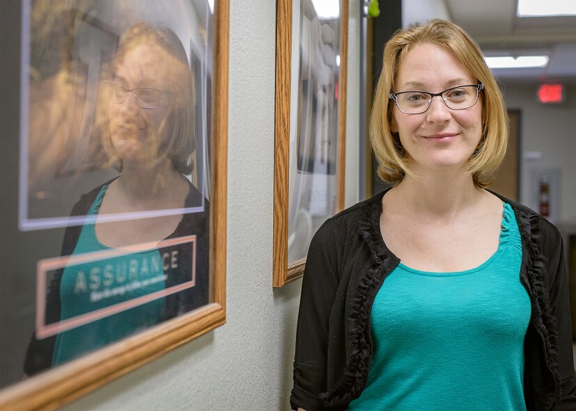 Shawn Kelley, an Air Force mental health specialist, at work in Building 826 at Vance Air Force Base, Oklahoma, June 18. Kelley is a member of the Enid Roller Girls, a nationally-sanctioned roller derby team, and uses the sport to bolster her resiliency skills. "People may get tired of hearing that they need to exercise three-five times a week," Kelley said, "but hands down, it does help." (U.S. Air Force photo/David Poe)