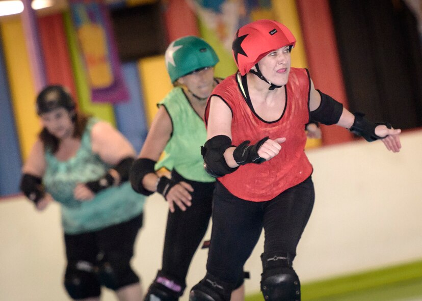 Shawn Kelley, a Vance Air Force Base mental health specialist, skates with teammates during roller derby practice in Enid, Oklahoma, June 18. "Derby filled a lot of things for me," the former Army reservist said about joining the Enid Roller Girls. "It gave me an instant support system." (U.S. Air Force photo / David Poe) 