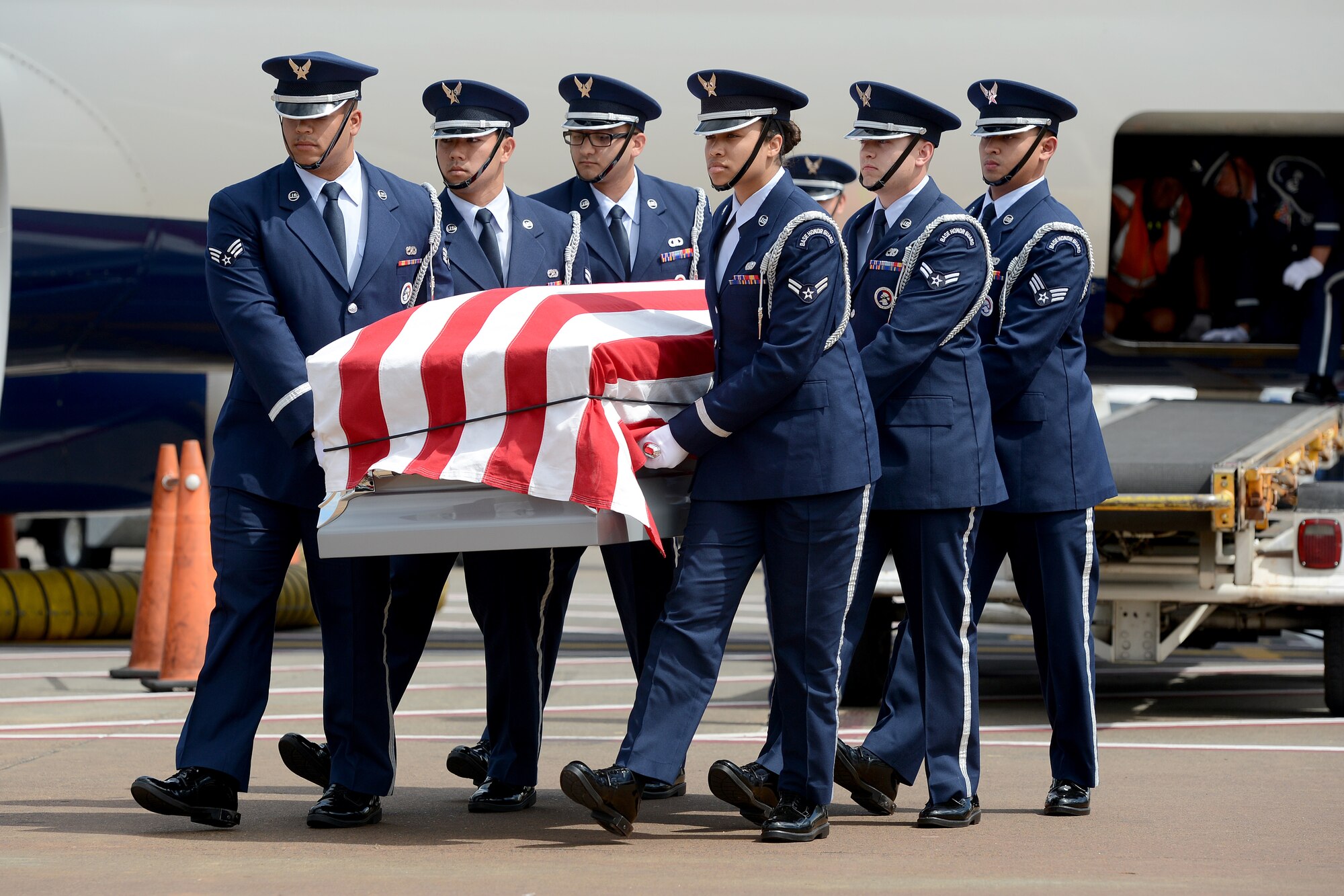 Members from the McChord Field Honor Guard pallbearer team carry a casket to a hearse July 24, 2015, at Portland International Airport, Ore. The team also carried the casket during the active duty honors ceremony on the next day. (U.S. Air Force photo/Airman 1st Class Keoni Chavarria)