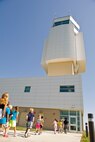 Children from the Youth Activities Center enter the air traffic control tower for a tour at Minot Air Force Base, N.D., July 24, 2015. Eleven kids under the age of nine toured the tower as one of their summer program field trips. (U.S. Air Force photo/ Airman 1st Class Justin T. Armstrong)