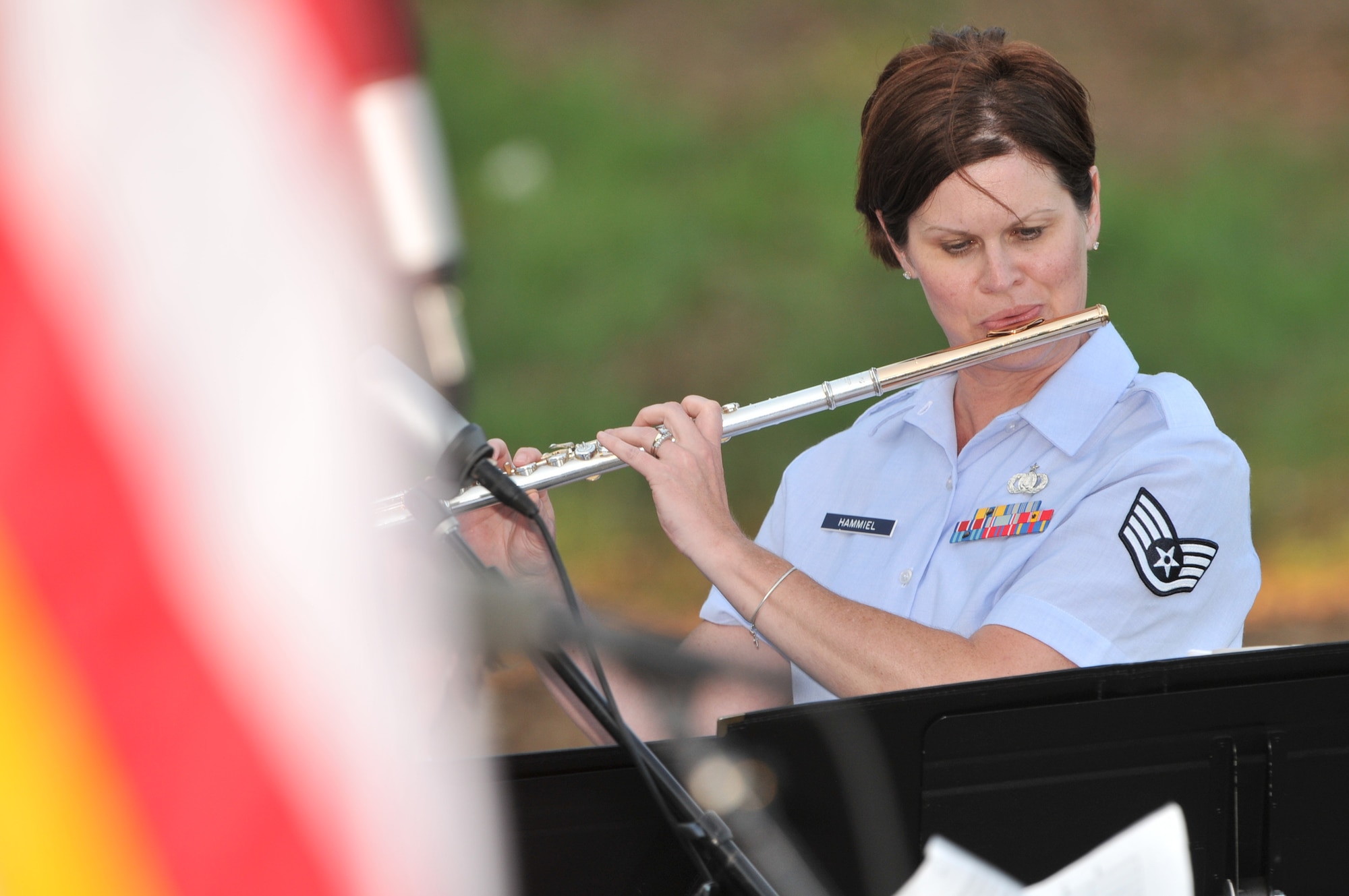 Staff Sgt. Kristi Hammiel, a musician with the Air National Guard Band of the Midwest based in Peoria, Ill plays the flute during a concert in Sioux City, Iowa on July 27, 2015. The 566th Air Force Band is performing in Sioux City as part of their summer concert series entitled “Hero’s Among Us”. As part of their two week annual training this year, the band is performing primarily in Iowa and South Dakota.
U.S. Air National Guard Photo by: Technical Sgt. William Wiseman/Released
