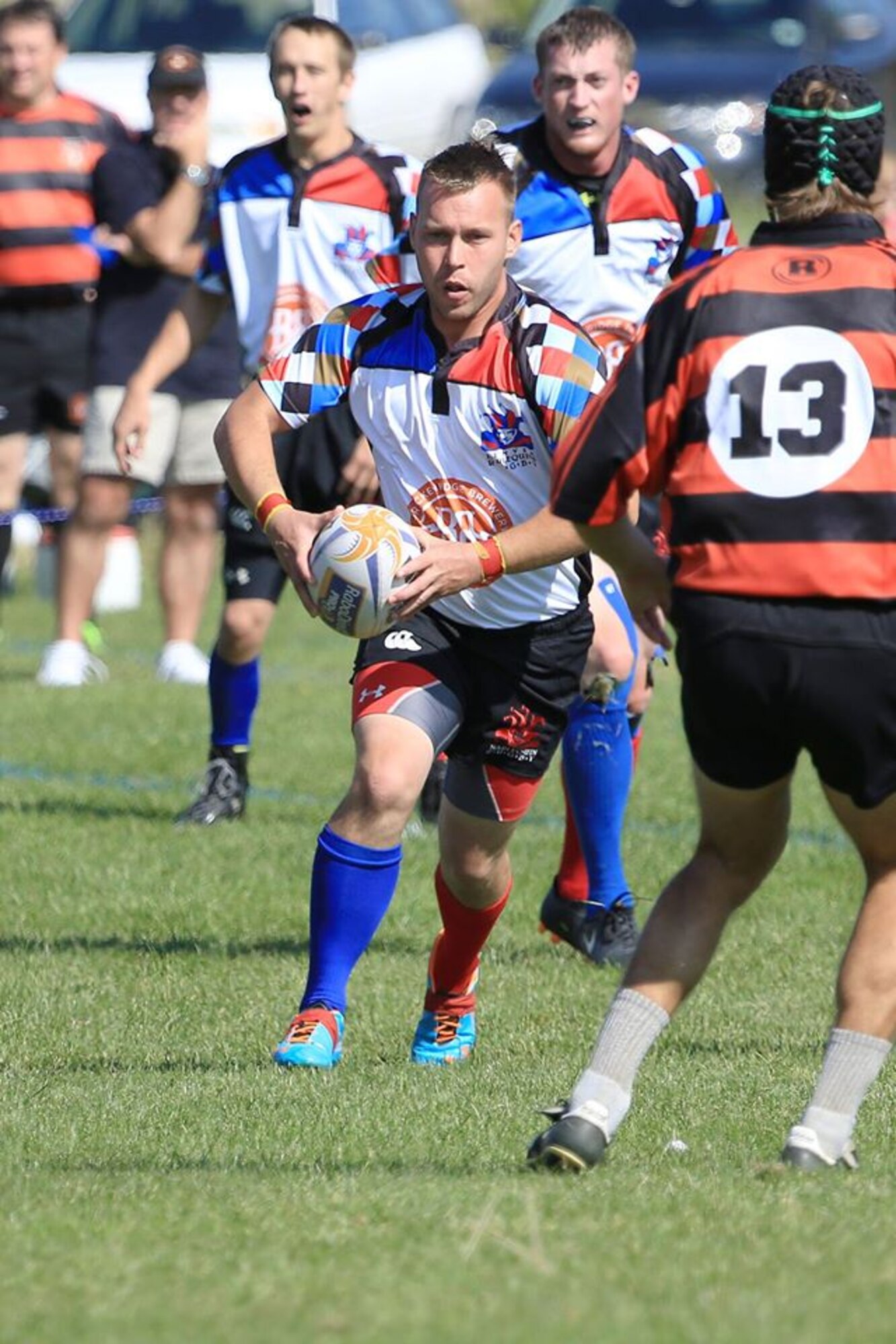 Senior Airman Theodore J. Szarzynski (pictured holding the ball), a space warning specialist with the 233rd Space Group, Colorado Air National Guard, is a member of this year's official Air Force Rugby Team. The team will compete against teams from other branches of the military to win the Armed Forces Championship during the annual Serevi Rugby 7’s tournament August 14-16 at Infinity Park, Glendale, Colo. (Photo courtesy of Senior Airman Theodore J. Szarzynski)