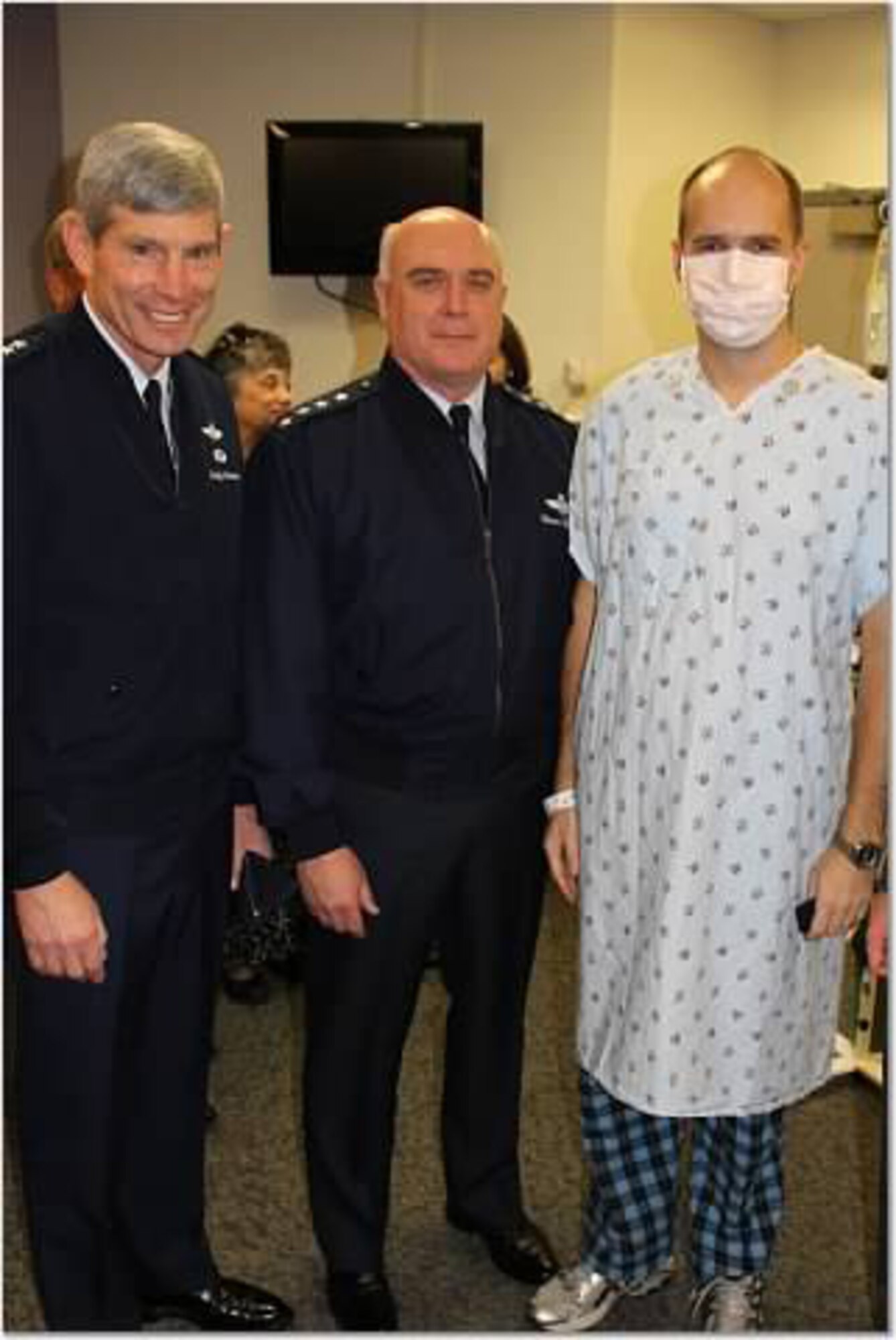 Lt. Col Ryan Keeney poses for a photo with Air Force Chief of Staff Gen. Norton Schwartz, left, and Vice Chief of Staff of the Air Force Gen. Carrol Chandler. The generals promoted Keeney while he was in the hospital battling Acute Myelogenous Leukemia. (Courtesy photo)