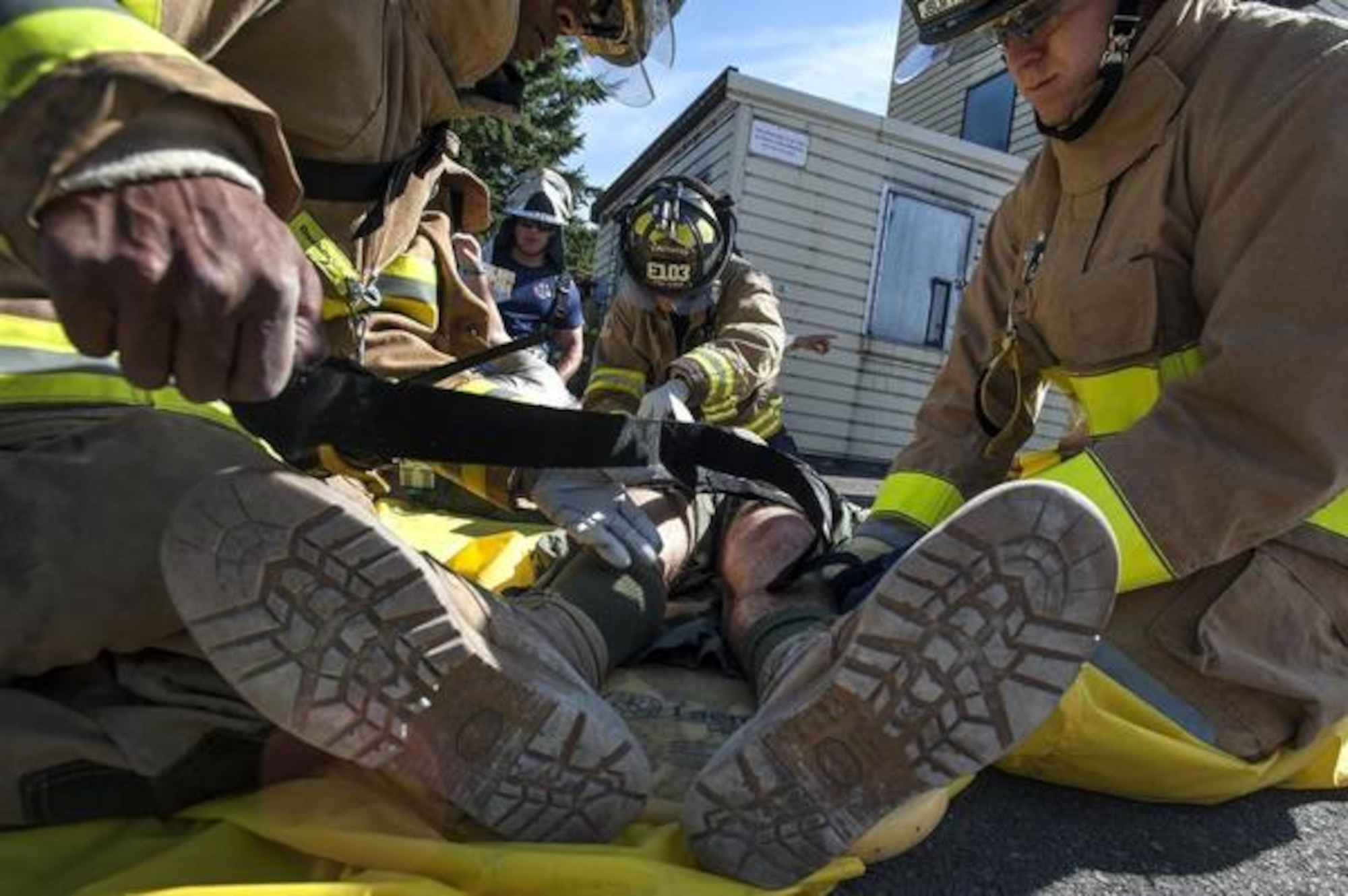 First responders attend to a simulated plane crash victim July 17 during the Shock Top full-scale exercise on McChord Field. (courtesy photo)