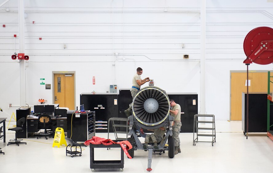 Members of the 23d Component Maintenance Squadron Propulsion Flight perform maintenance on a TF-34 engine July 27, 2015, at Moody Air Force Base, Ga. The 23d CMS supplies the 74th and 75th Fighter Squadrons with TF-34’s in support of Moody’s A-10C Thunderbolt II aircraft. (U.S. Air Force photo by Airman Greg Nash/Released)