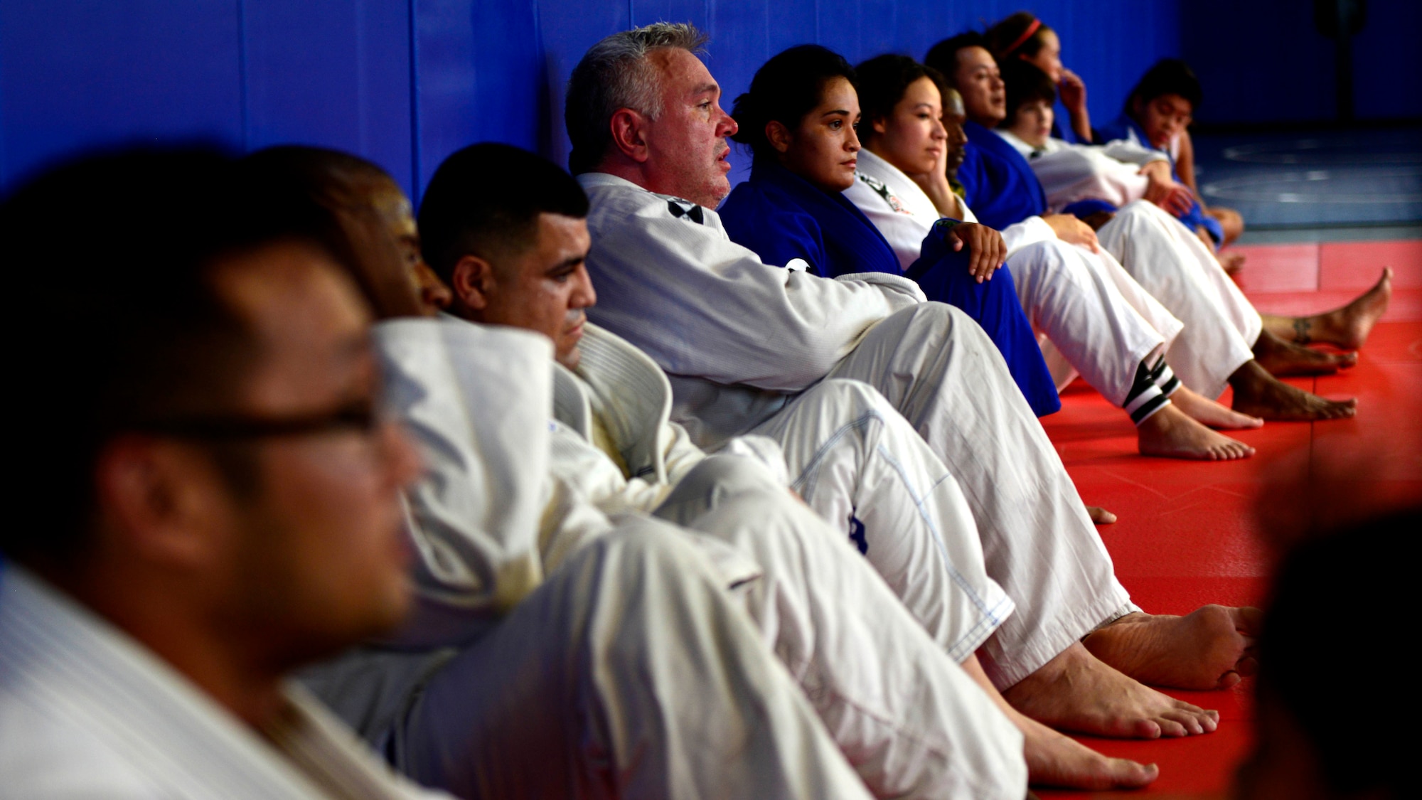 Jiu Jitsu Class students watch a demonstration, July 27, 2015, at Aviano Air Base, Italy. The Wyvern Fitness Center hosts jiu jitsu classes for various age groups, Monday through Friday. (U.S. Air Force photo by Senior Airman Areca T. Wilson/Released)