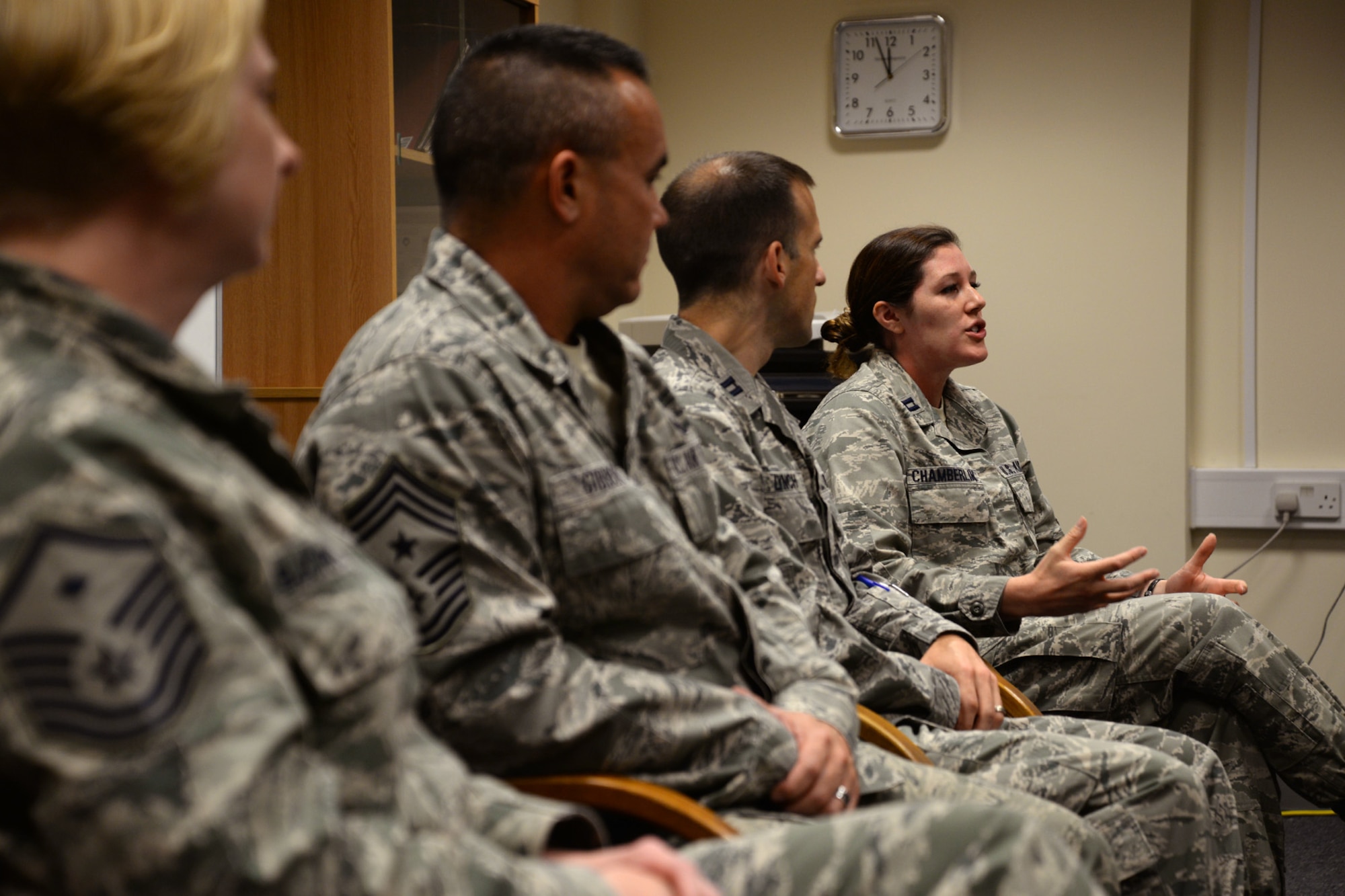 U.S. Air Force Capt. Allison Chamberlin, right, 95th Reconnaissance Squadron intel flight commander and 100th Air Refueling Wing alternate sexual assault response coordinator from Standish, Maine, speaks as a panel member during a Sexual Assault Prevention and Response lunch-and-learn July 28, 2015, on RAF Mildenhall, England. The lunch-and-learn provided Airmen across base the chance to come together and talk about sexual assault with a panel of base leadership. The SAPR office provides lunch-and-learns on a monthly basis. The panel consisted of a first sergeant, the command chief, air defense council and a victim advocate. (U.S. Air Force photo by Senior Airman Christine Halan/Released)