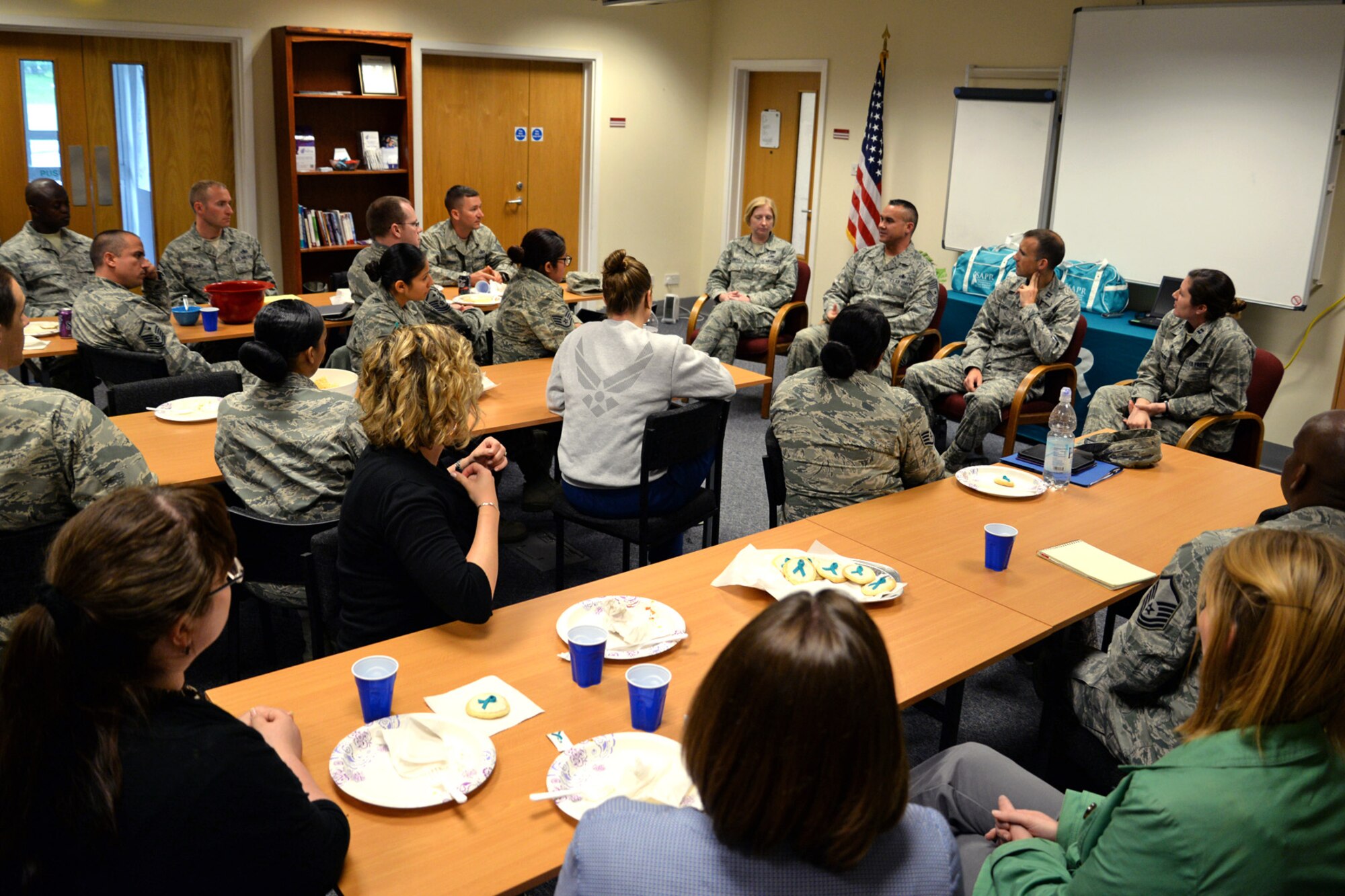 Members of Team Mildenhall listen as U.S. Air Force Chief Master Sgt. Robert Gibbons, 352nd Special Operations Wing command chief speaks during a Sexual Assault Prevention and Response lunch-and-learn, July 28, 2015, on RAF Mildenhall, England. The lunch-and-learn aimed to provide Airmen across base the chance to come together and talk about sexual assault with a panel consisting of a first sergeant, command chief, air defense council and victim advocate. The SAPR office provides lunch-and-learns on a monthly basis. (U.S. Air Force photo by Senior Airman Christine Halan/Released)
