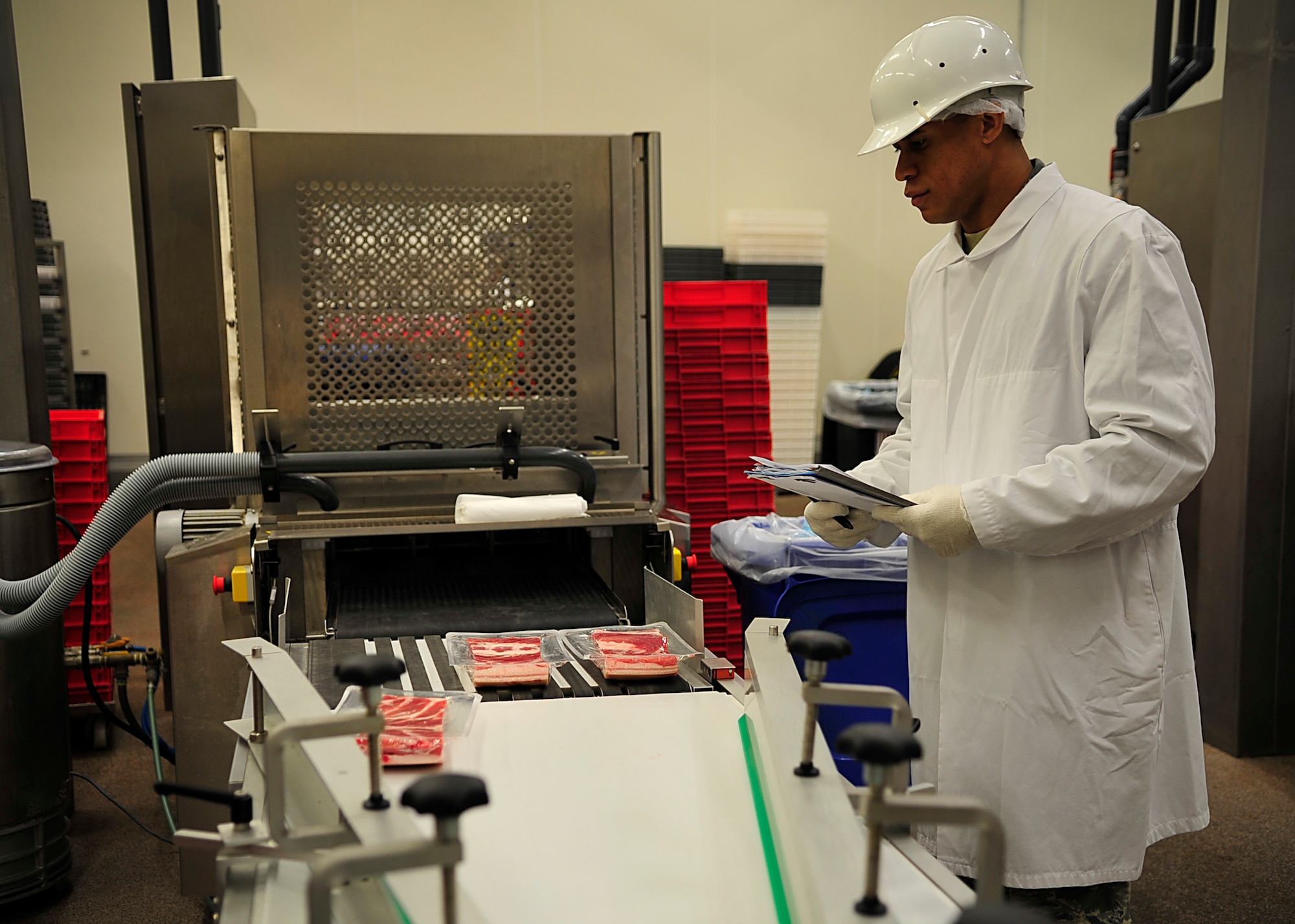 Senior Airman Allen R. Cherry III, 86th Aerospace Medicine Squadron Public Health technician, ensures proper packaging and labelling of meat products June 26, 2015, at Ramstein Air Base, Germany. Cherry was officially announced one of the 12 Outstanding Airmen of the Year on July 27. (U.S. Air Force photo/Airman 1st Class Larissa Greatwood)