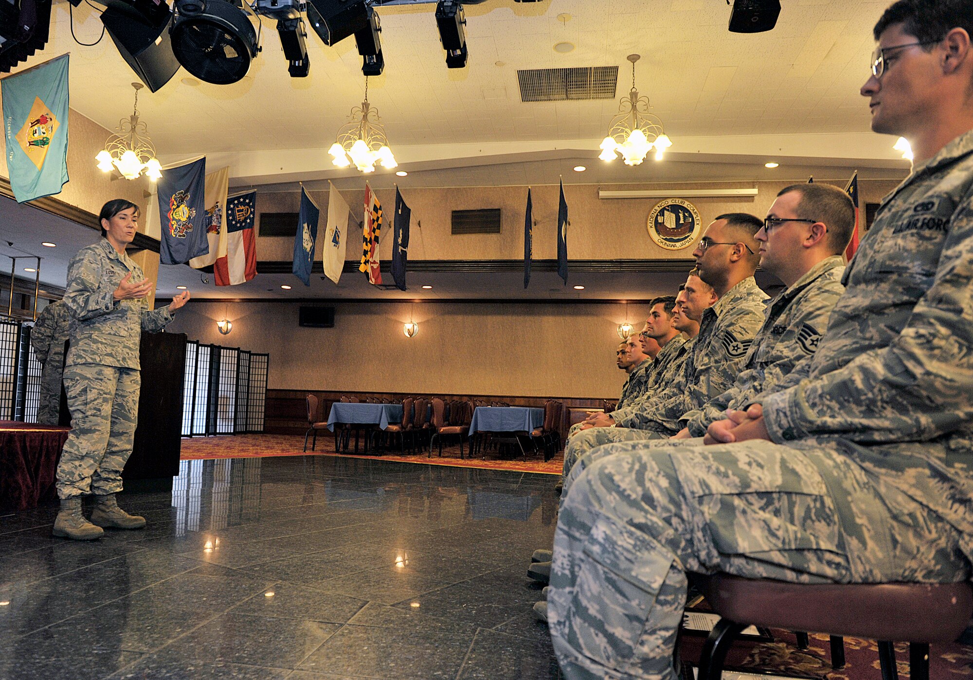 U.S. Air Force Col. Debra Lovette, 18th Mission Support Group commander, concludes the NCO induction ceremony at the Rocker NCO Club on Kadena Air Base, Japan, July 28, 2015. The ceremony celebrates and recognizes those who have recently put on the rank of staff sergeant and have reached the status of NCO. (U.S. Air Force photo by Naoto Anazawa)