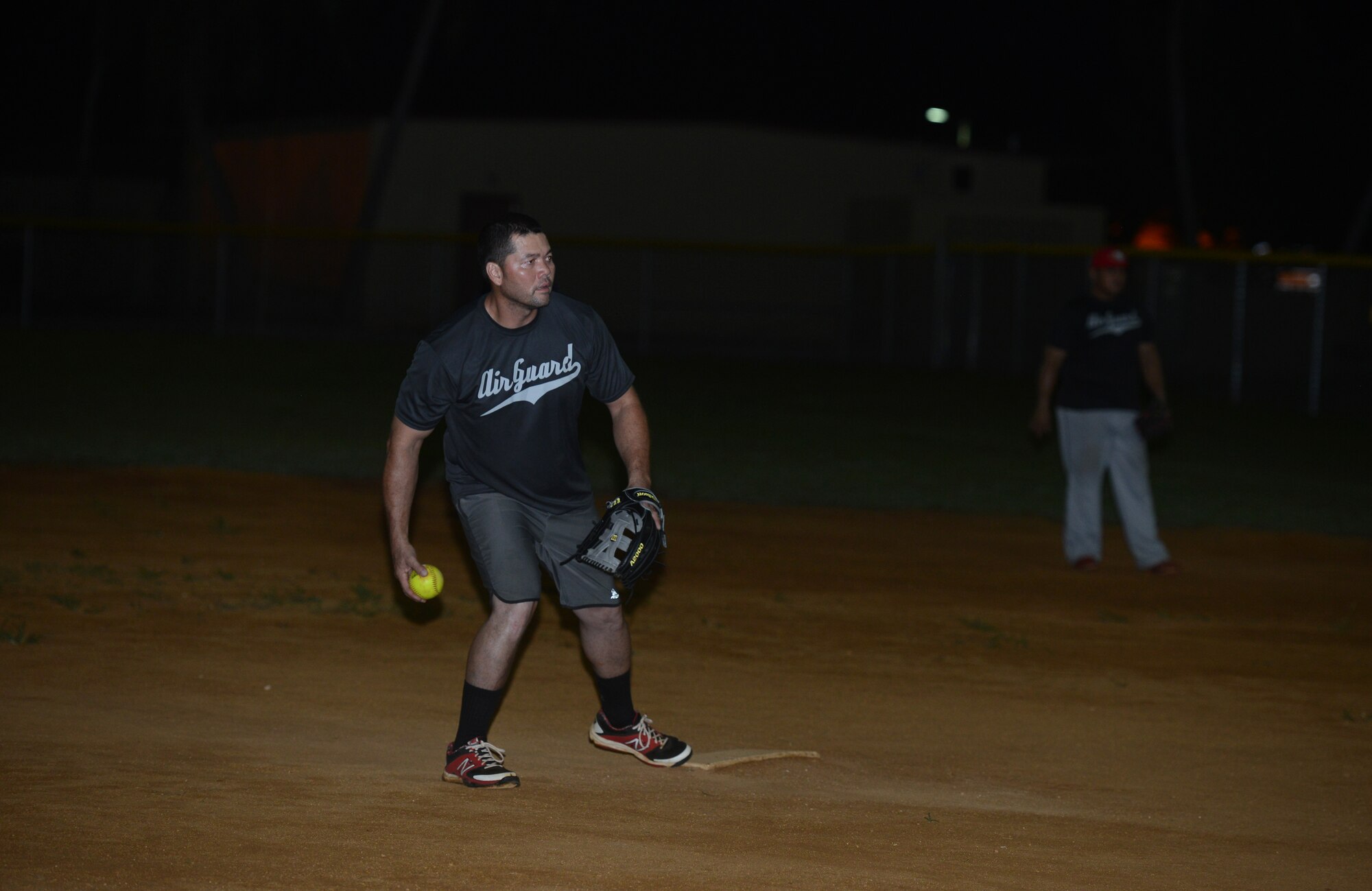 Cliff Raphael, Guam Air National Guard, gets ready to pitch to a batter during the intramural softball championship game between the 36th Civil Engineering Squadron and GU ANG July 28, 2015, at Andersen Air Force Base, Guam. The GU ANG won the game with a score of 16-12. (U.S. Air Force photo by Airman 1st Class Arielle Vasquez/Released)
