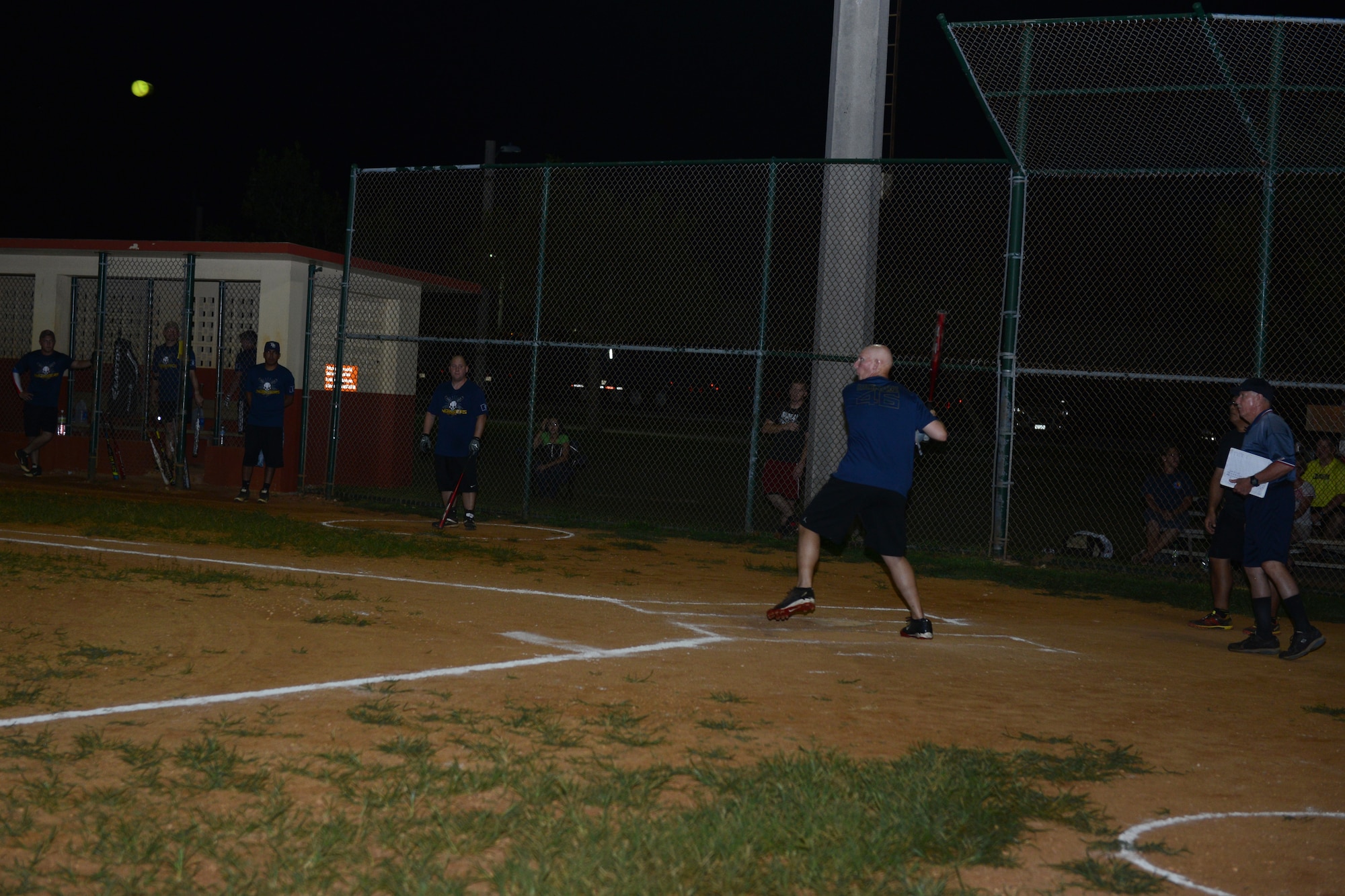 Donald McNair, 36th Civil Engineer Squadron, prepares to hit the ball during the intramural softball championship game between the 36th CES and Guam Air National Guard July 28, 2015, at Andersen Air Force Base, Guam. The GU ANG won the game with a score of 16-12. (U.S. Air Force photo by Airman 1st Class Arielle Vasquez/Released)