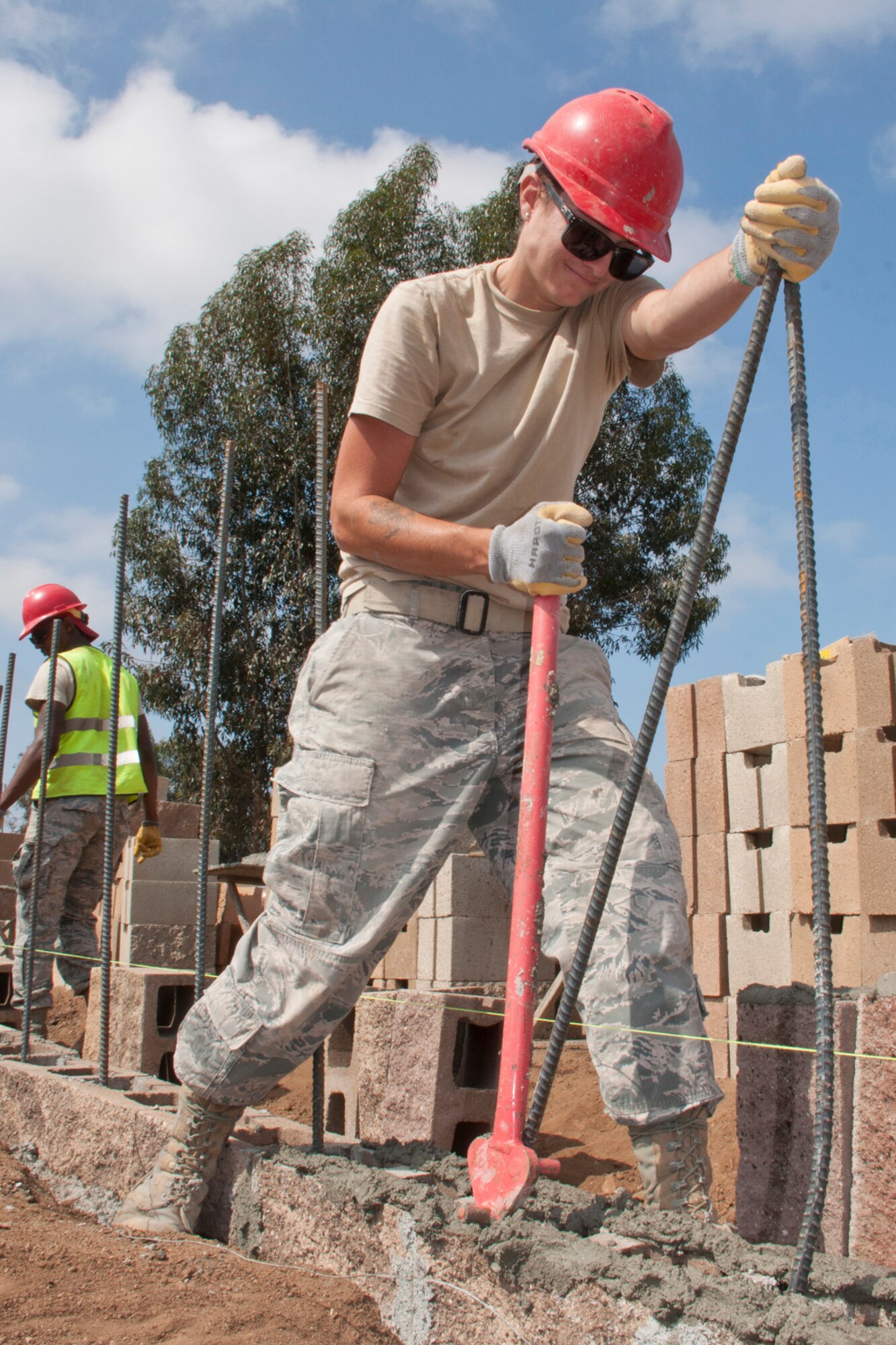 U.S. Air Force Senior Airman Amber Craig, a structural civil engineer assigned to the 555th RED HORSE Squadron at Nellis Air Force Base, Nev., bends rebar for a perimeter wall being constructed for Training, Education, Research and Innovation (TERI) Inc., in San Marcos, Calif., June 10, 2015. The project is one of many civil-military Innovative Readiness Training programs, (IRT) which are conducted within the U.S., its territories and possessions by our military, especially our Guard and Reserve forces. (U.S. Air Force photo by Master Sgt. Jeff Walston)