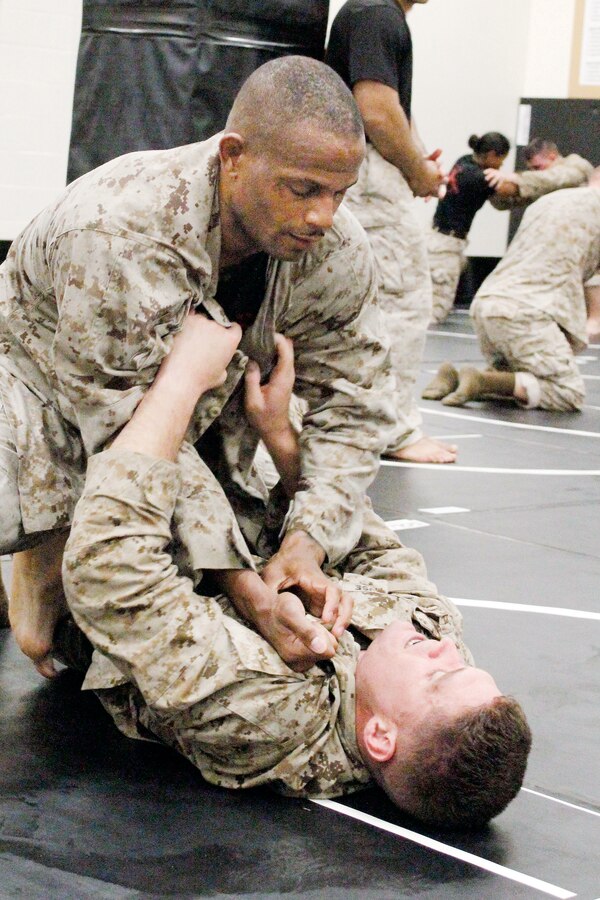 Photo from front page of the July 30, 2015 edition of the Quantico Sentry. Image highlights the MCMAP training at Raider Hall in The Basic Hall on Marine Corps Base Quantico.