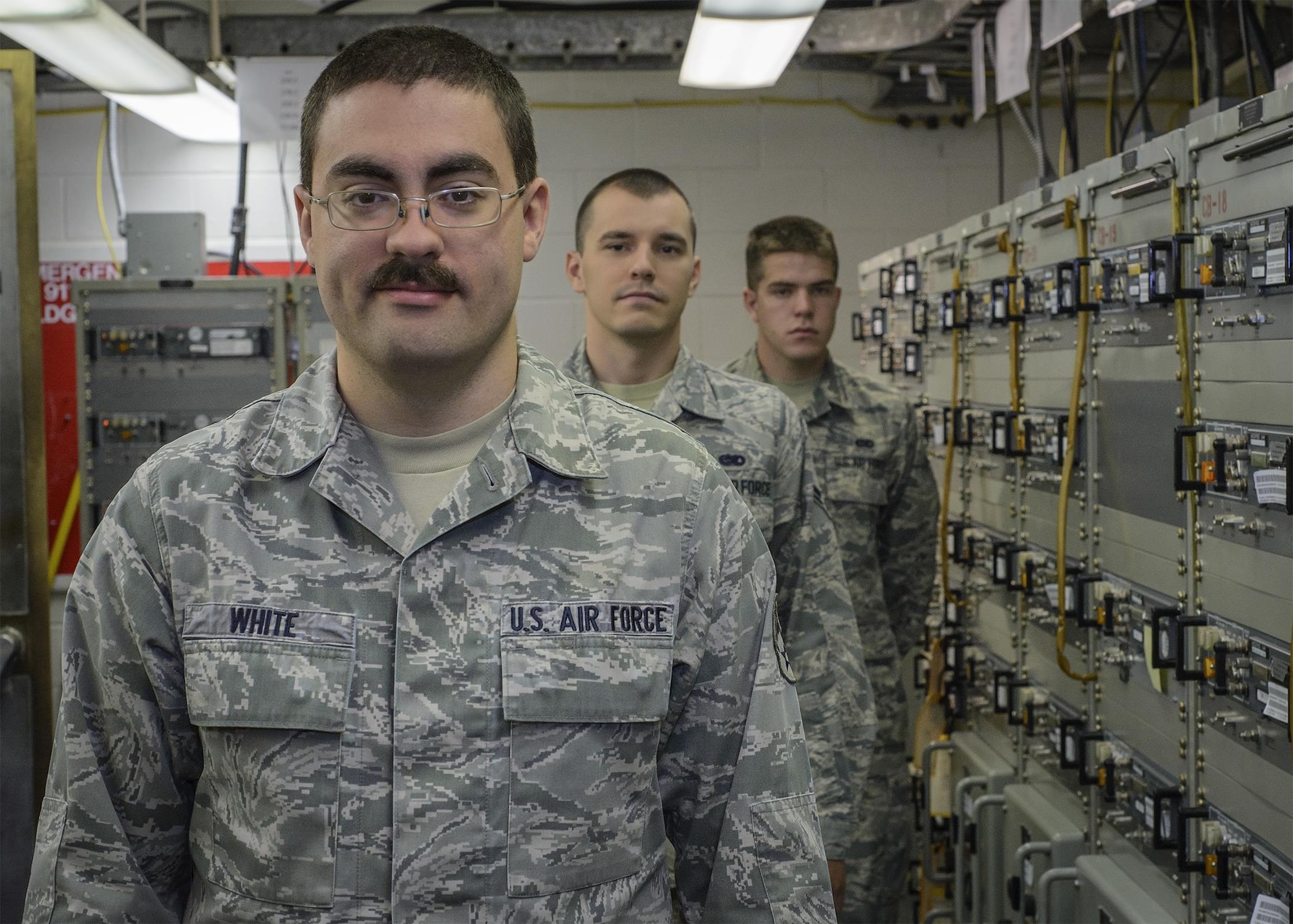 Senior Airman Thomas White, a 71st Operations Support Squadron Airman, and some of his wingmen at the Airfield Systems Maintenance shop at Vance Air Force Base, Oklahoma, June 25. (U.S. Air Force photo by David Poe)