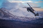An HH-60 Pave Hawk helicopter from the 210th Rescue Squadron, Alaska Air National Guard, practices “touch and go” maneuvers at Bryant Army Airfield on Joint Base Elmendorf-Richardson, Dec. 17, 2014. A similar craft helped save two hikers.