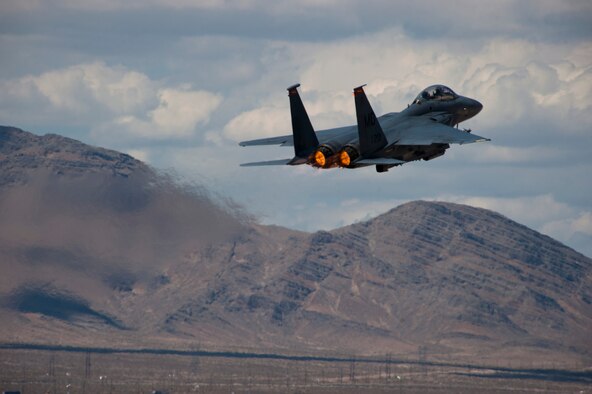 An F-15E Strike Eagle assigned to the 389th Fighter Squadron takes off during Red Flag 15-3 at Nellis Air Force Base, Nev., July 21, 2015. Aircraft and personnel deploy to Nellis AFB for Red Flag under the air expeditionary force concept and make up the exercise's "blue" forces. By working together, these blue forces are able to utilize the diverse capabilities of their aircraft to execute specific missions, such as air interdiction, combat search and rescue, close air support, dynamic targeting, and defensive counter air. The 389th FS is from Mountain Home AFB, Idaho. (U.S. Air Force photo/Senior Airman Thomas Spangler)