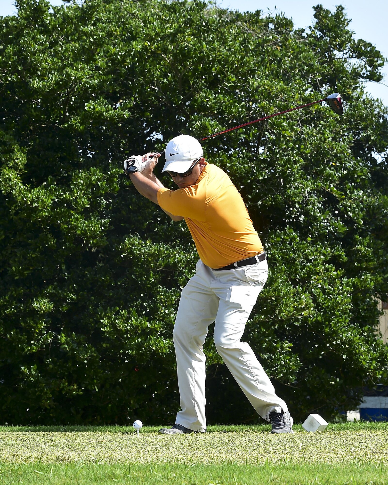 Capt. Joseph Farinash, 1st Special Operations Security Forces Squadron operations officer, tees off during a golf tournament on Hurlburt Field, Fla., July 24, 2015. The golf tournament raised money for the Hurlburt Air Force Ball. (U.S. Air Force photo/Senior Airman Jeff Parkinson)