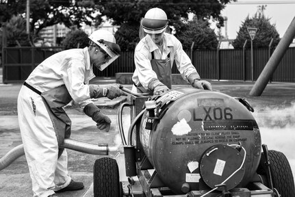 In this photo, Senior Airman William Oppenheim, 374th Logistics Readiness Squadron fuels mobility support technician, issues liquid oxygen to a LOX cart July 29, 2015, at Yokota Air Base, Japan. Liquid oxygen is necessary for pilots to breathe while flying at high altitudes. The graphic was made using Adobe Photoshop to merge two different images together. 