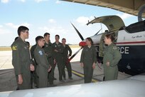 Major Erin Shay, (right) and Capt. Kelly Wolter, 559th Flying Training Squadron flight instructors, brief Air Force Academy cadets on the T-6 Texan ll aircraft, July 28, 2015 at Joint Base San Antonio-Randolph.  The cadets are being exposed to different career fields, which can be chosen upon graduation. The 559th FTS provides training for instructor pilots utilizing the T-6 Texan ll aircraft, which is used to teach pilots basic flying skills.  (U.S Air Force photo by Joel Martinez/Released)