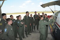Major Erin Shay, (right) and Capt. Kelly Wolter, 559th Flying Training Squadron flight instructors, brief Air Force Academy cadets on the T-6 Texan ll aircraft July 28, 2015 at Joint Base San Antonio-Randolph.  The cadets are being exposed to different career fields, which can be chosen upon graduation. The 559th FTS provides training for instructor pilots utilizing the T-6 Texan ll aircraft, which is used to teach pilots basic flying skills.  (U.S Air Force photo by Joel Martinez/Released)
