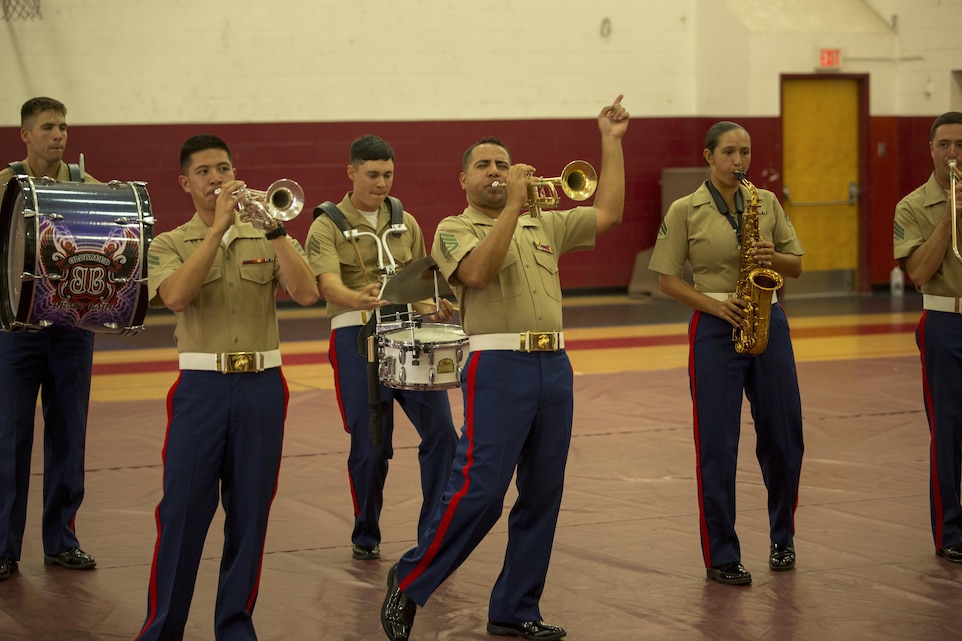 Staff Sgt. Steven Santiago, musician, 1st Marine Division Band, entertains the audience during a performance at the West Gym, July 21, 2015. The band performed as part of the Combat Center Library’s Summer Reading Program with this year’s theme being "Read to the Rhythm."(Official Marine Corps photo by Pfc. Levi Schultz/Released)