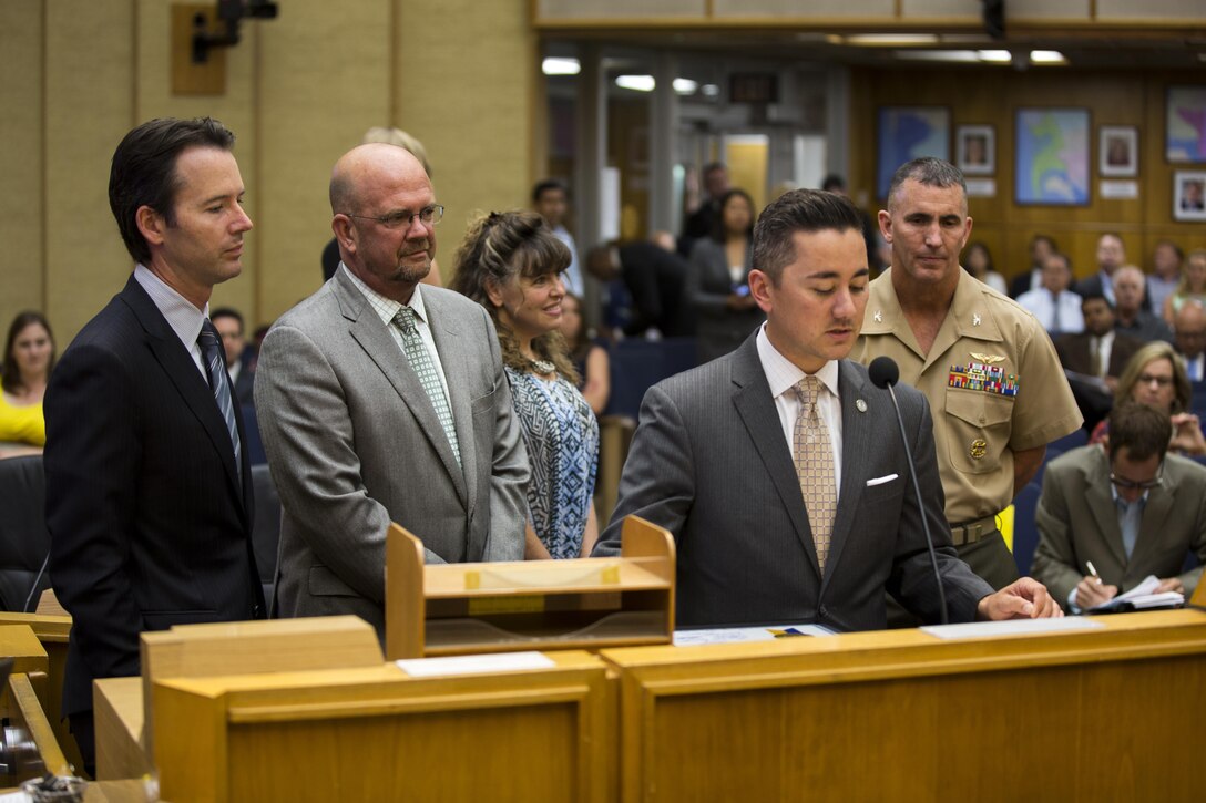Chris Cate, San Diego councilman for Sixth District, says a few words about Col. John Farnam, commanding officer of Marine Corps Air Station Miramar, during the “Colonel John P. Farnam Day” proclamation at the San Diego City Council Chambers, July 28. The city council members also described Farnam’s initiatives during his time at MCAS Miramar, including his conservation efforts on the installation. (U.S. Marine Corps photo by Cpl. Michael Thorn/Released)